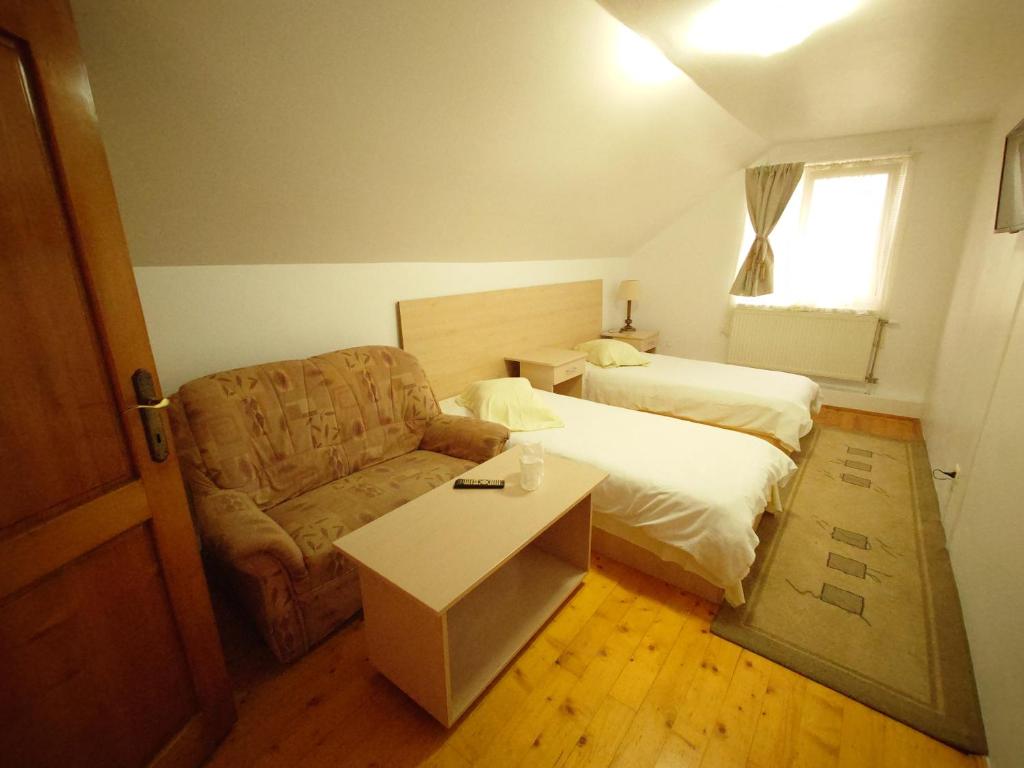 Katil atau katil-katil dalam bilik di Pensiunea San