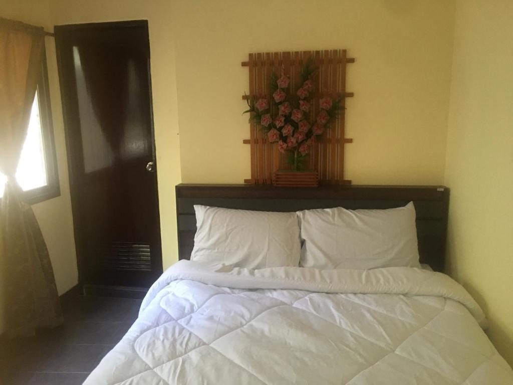 Giường trong phòng chung tại GUNG Apartment