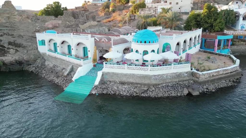 an aerial view of a house on a island in the water at Miskaa Nubian House in Naj‘ Tinjār