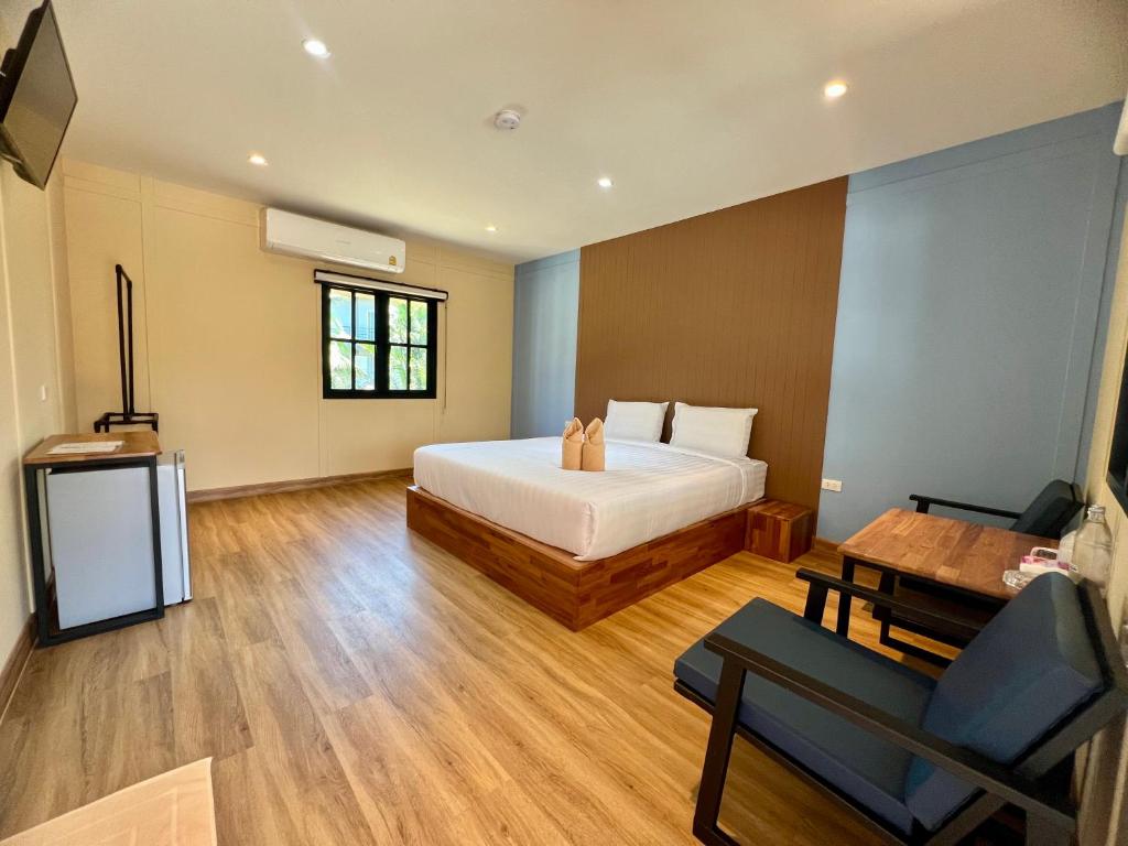 Postel nebo postele na pokoji v ubytování Napdown Resort Trat นับดาว รีสอร์ท ตราด