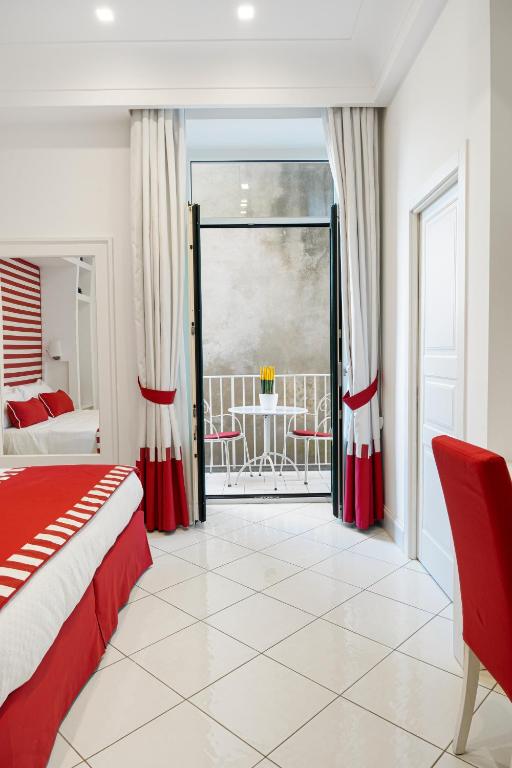Postel nebo postele na pokoji v ubytování Duomo Guest House - Stay in Sorrento