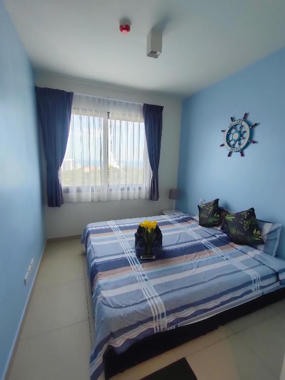 Postel nebo postele na pokoji v ubytování unixx seaview