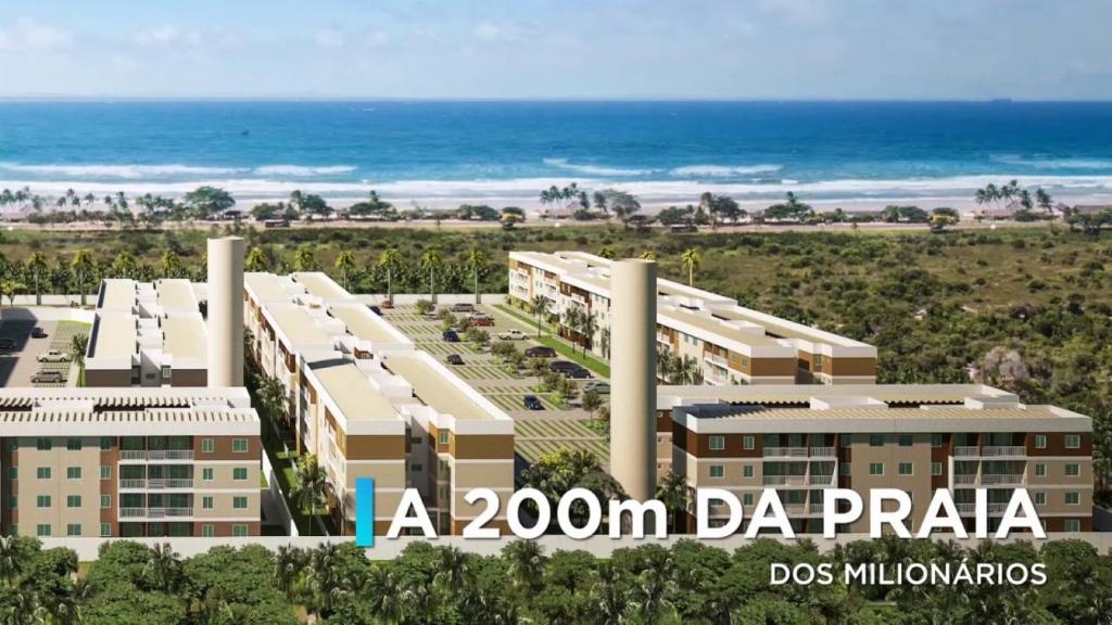 APARTAMENTO EM ILHÉUS - PRAIA DOS MILIONÁRIOS - VOG ATLÂNTICO - Pé na Areia في ايليوس: اطلالة على الشاطئ من غرفة في شقة غرفة