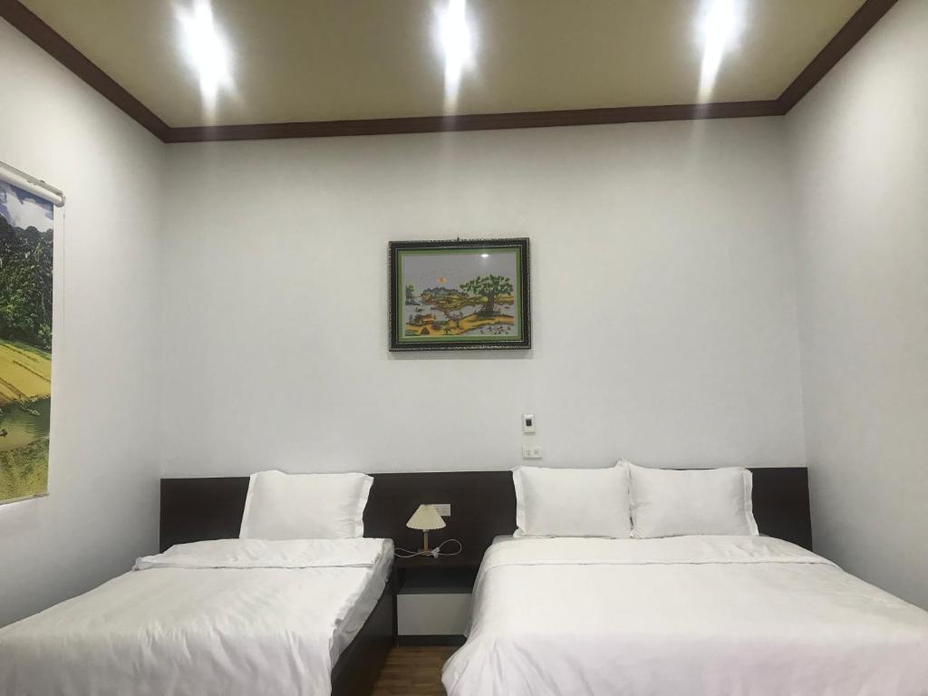 En eller flere senge i et værelse på Hải Lê Tam Coc Happy Homestay
