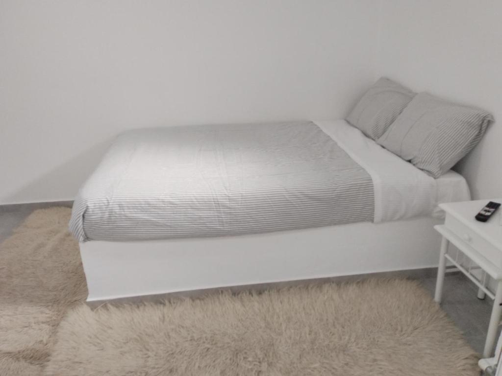 Postel nebo postele na pokoji v ubytování AFRODITE
