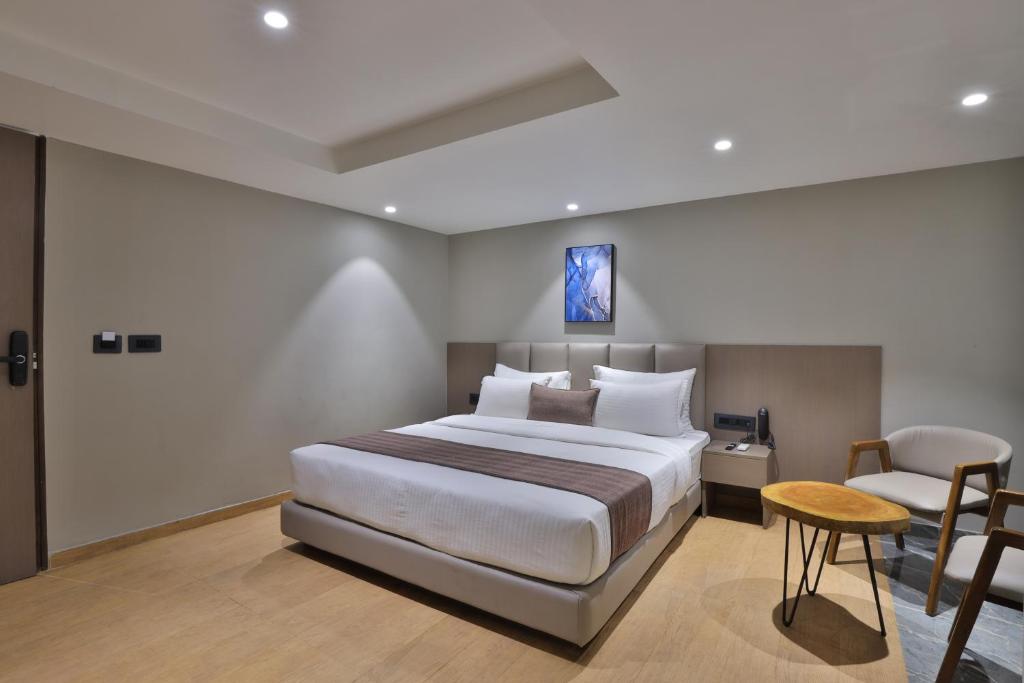 Postel nebo postele na pokoji v ubytování Hotel Shivashish
