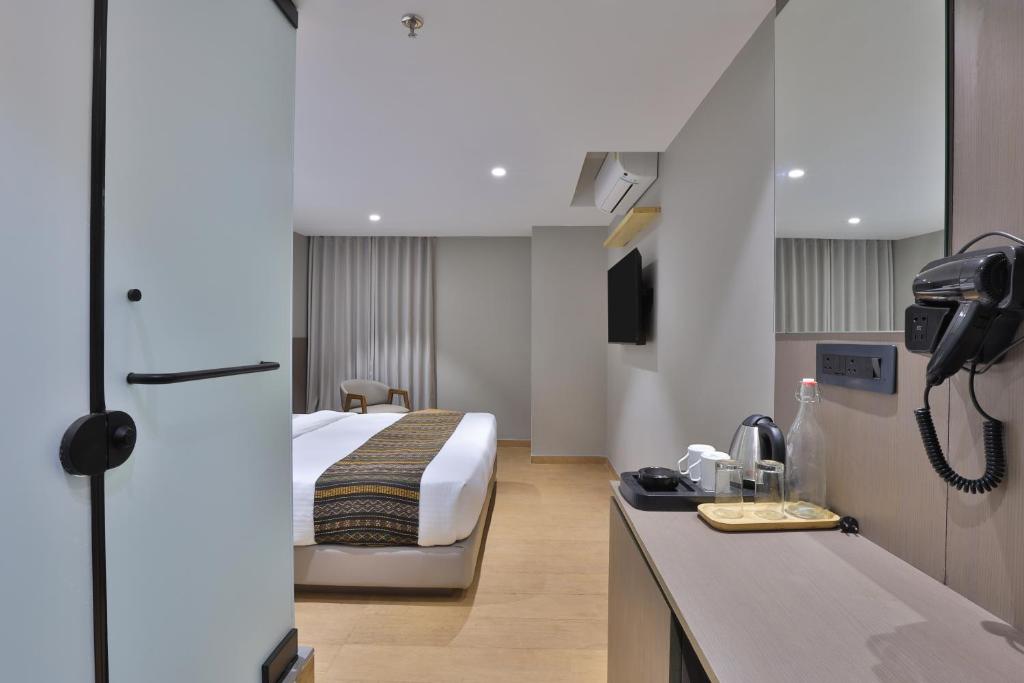 Postel nebo postele na pokoji v ubytování Hotel Shivashish