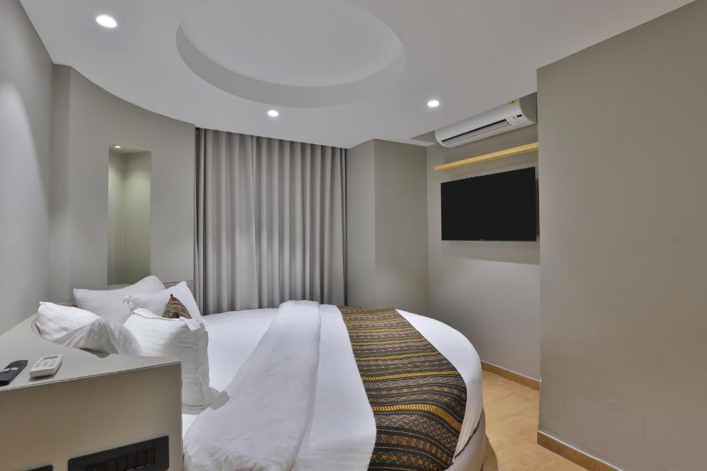 Postel nebo postele na pokoji v ubytování Hotel Shivashish