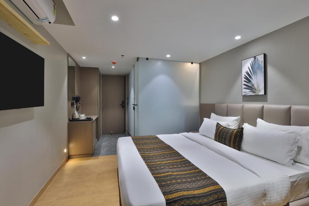 Postel nebo postele na pokoji v ubytování Hotel Shivashish