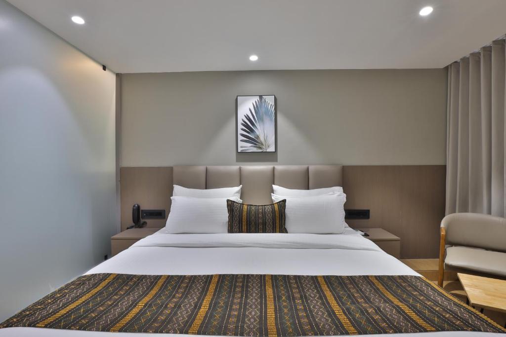 Postel nebo postele na pokoji v ubytování Hotel Shivashish