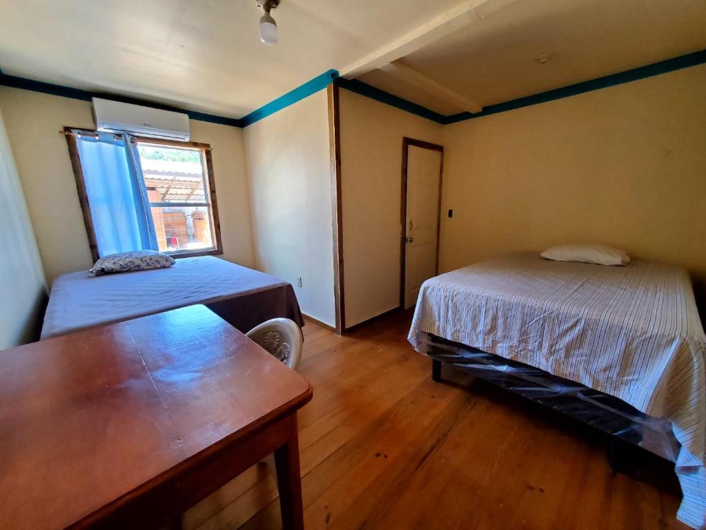 Postel nebo postele na pokoji v ubytování Hotel Caribbean Inn