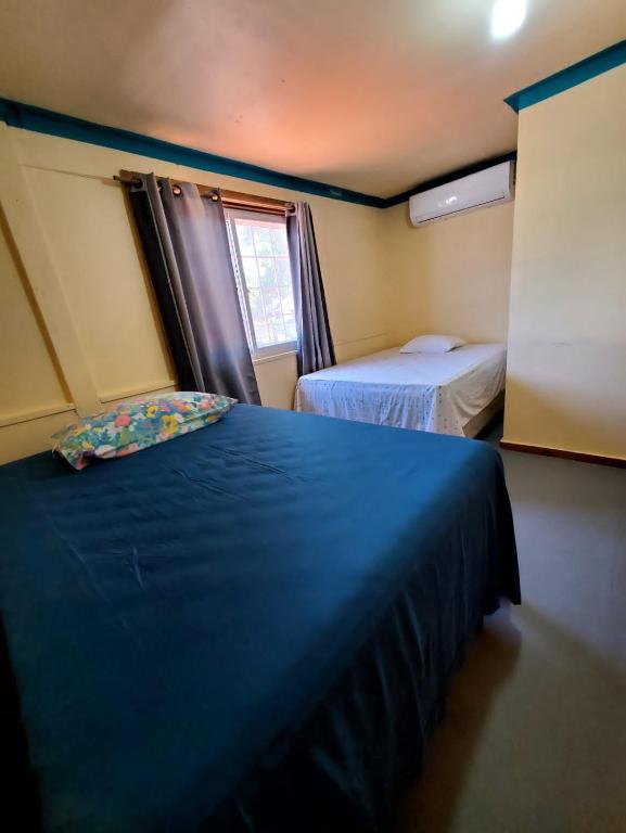 Postel nebo postele na pokoji v ubytování Hotel Caribbean Inn