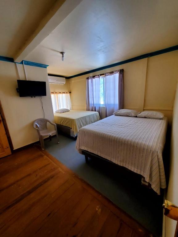 Postel nebo postele na pokoji v ubytování Hotel Caribbean Inn