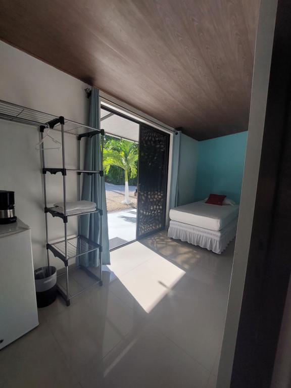 Postel nebo postele na pokoji v ubytování Hotel Carlota Tamarindo