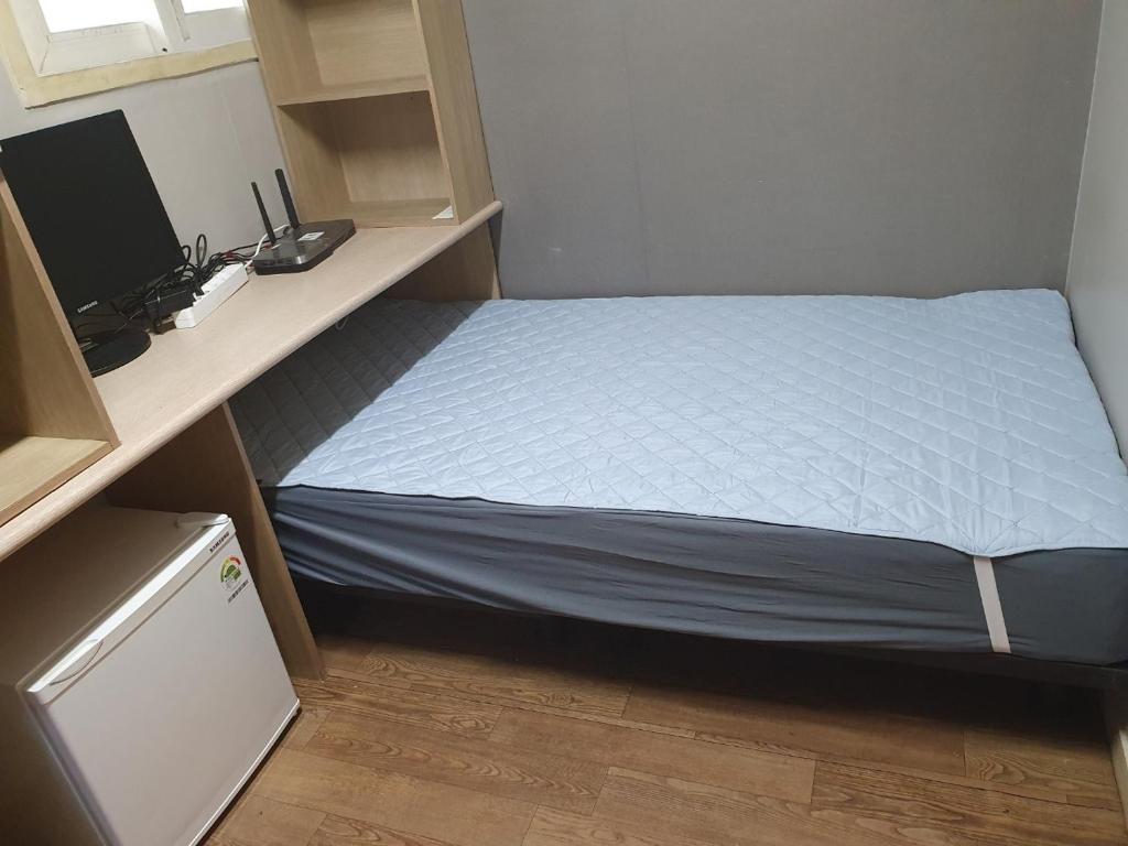 Postel nebo postele na pokoji v ubytování Halla Livingtel