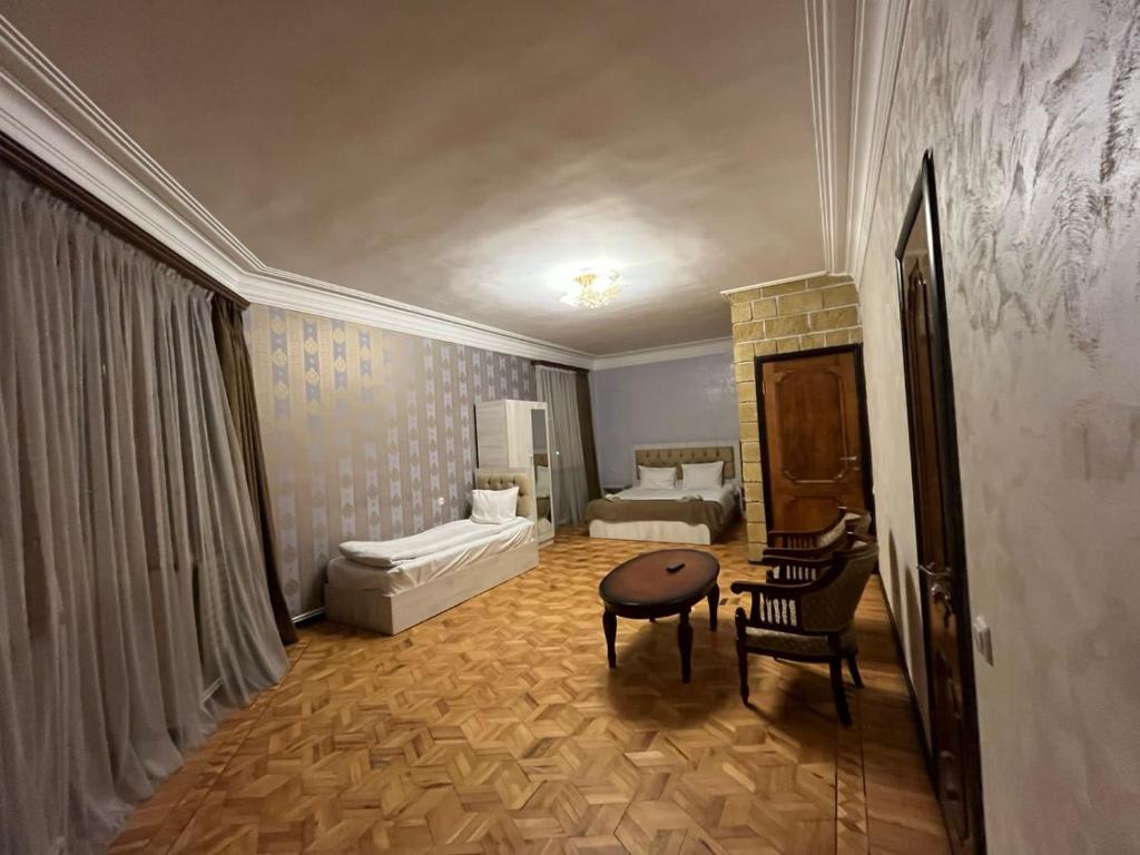 Postel nebo postele na pokoji v ubytování Baron Hotel