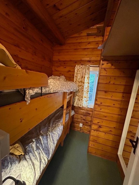 Voodi või voodid majutusasutuse Cosy Log Cabin Snowdonia Eryri toas