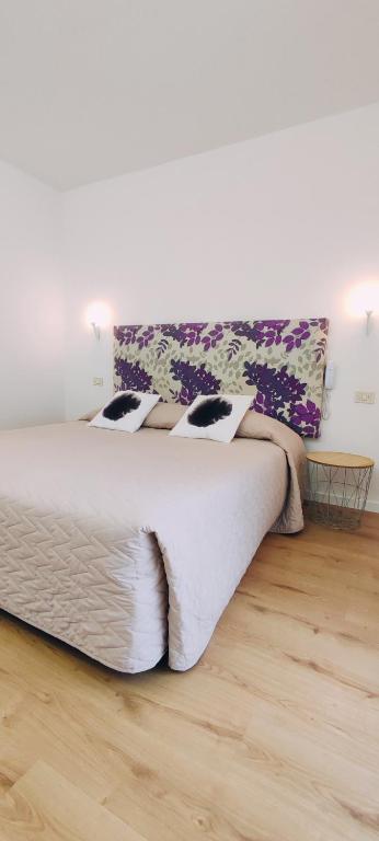 Posteľ alebo postele v izbe v ubytovaní Hotel Everest Arco