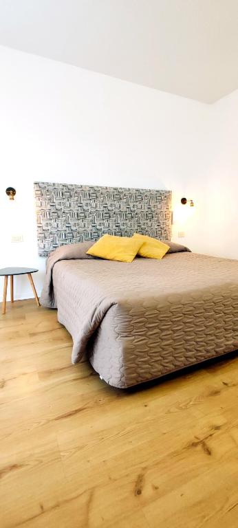 Posteľ alebo postele v izbe v ubytovaní Hotel Everest Arco