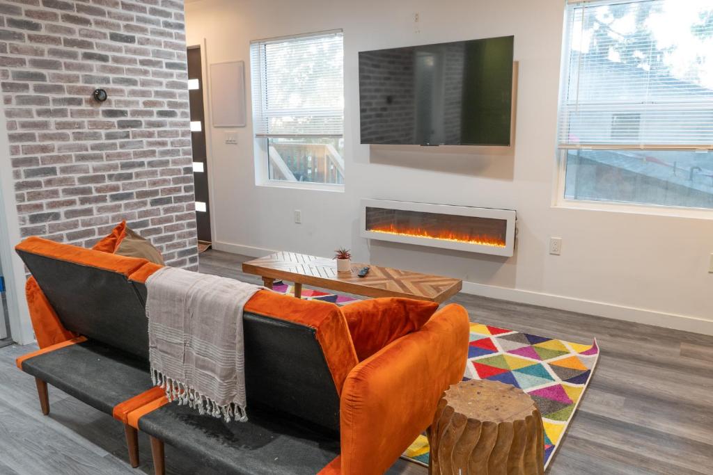 a living room with a couch and a fireplace at Peaceful Villa in Los Angeles