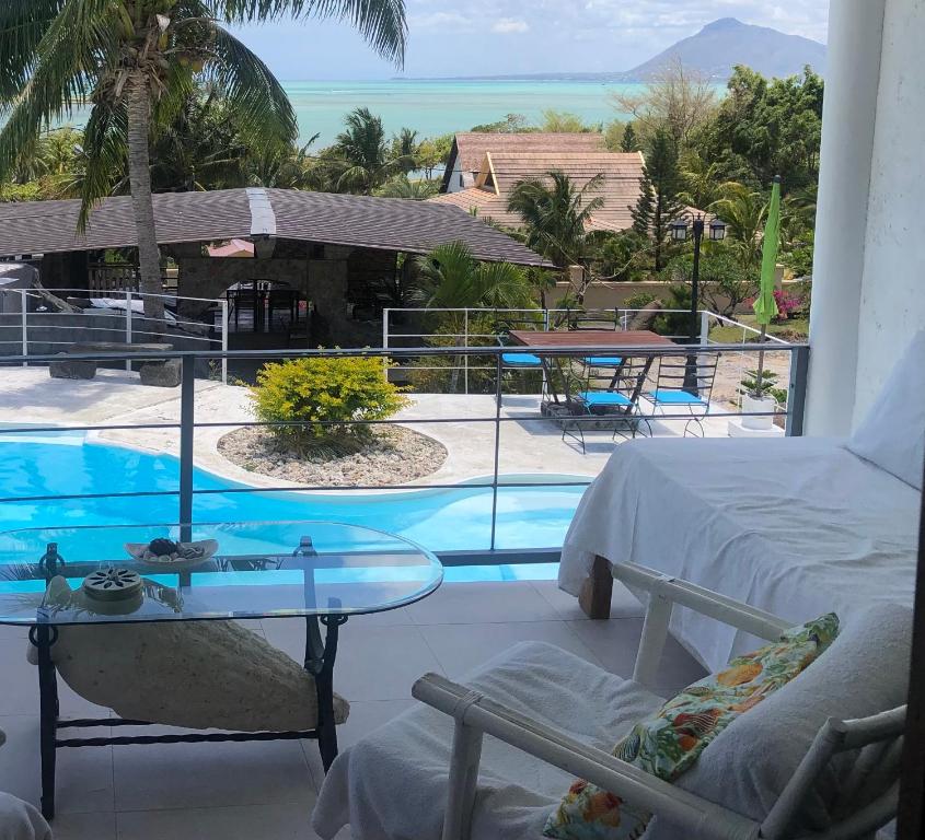 a room with a view of a swimming pool at Ma Vie La in Le Morne