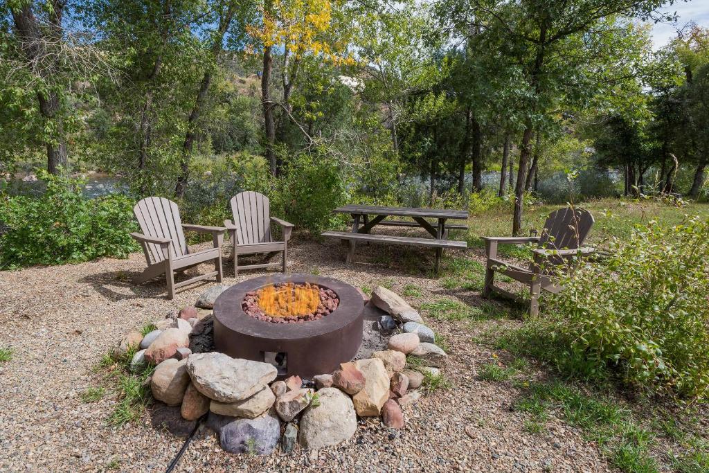 a fire pit with two chairs and a picnic table at CR 213 - Combo in Durango