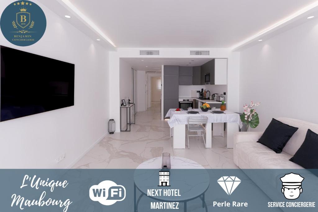 een witte woonkamer met een bank en een tafel bij L'unique Maubourg - Next Hotel Martinez - Terrasse in Cannes
