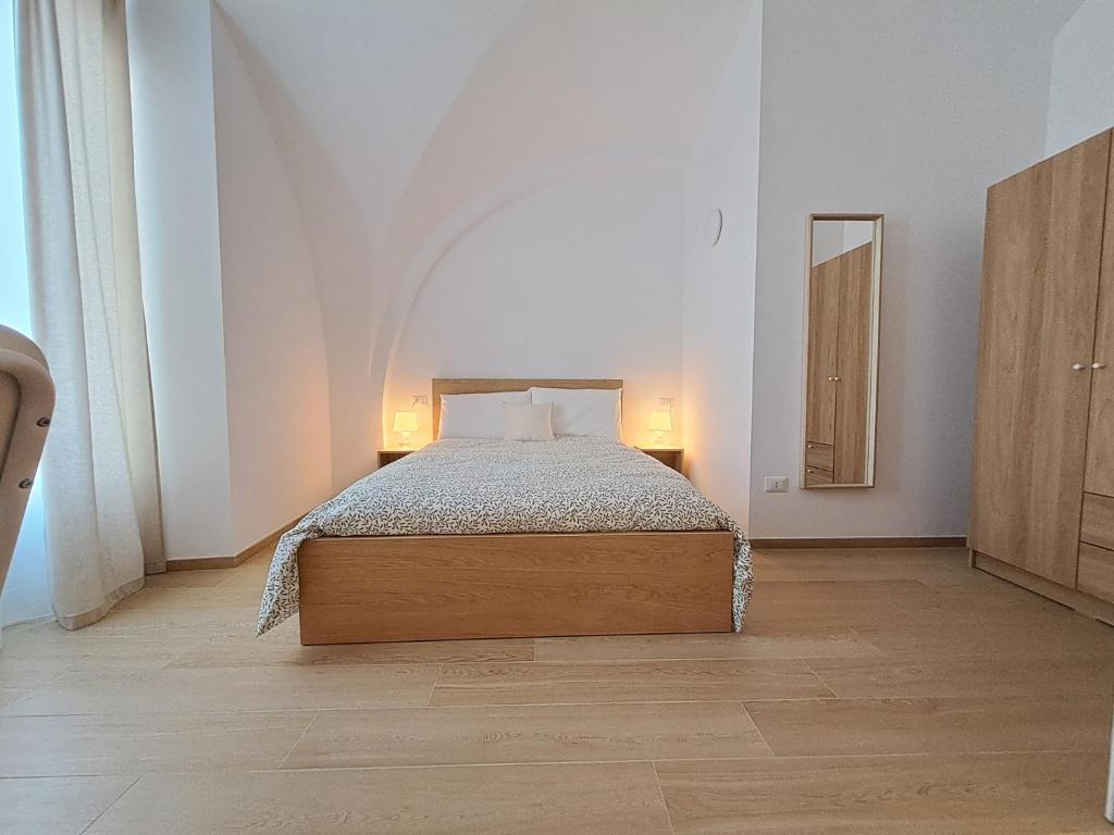 Postel nebo postele na pokoji v ubytování la casa sull arco
