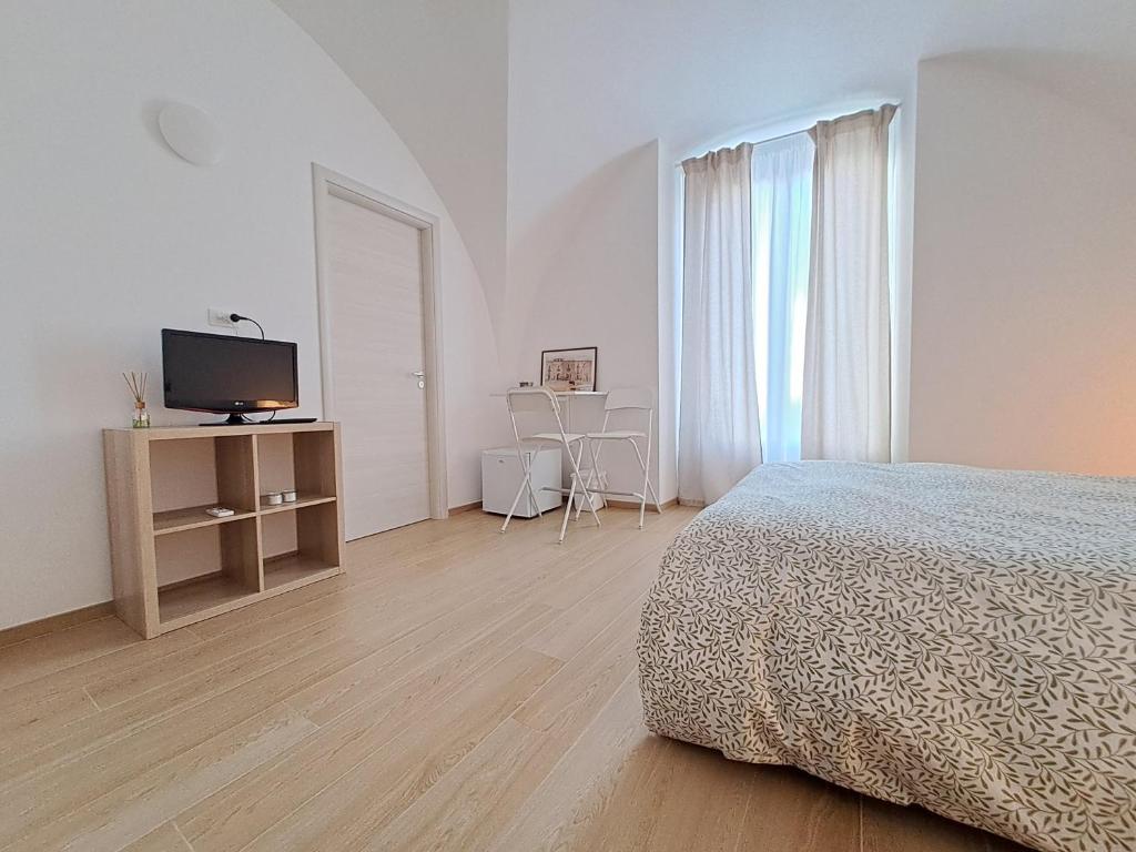 Postel nebo postele na pokoji v ubytování la casa sull arco