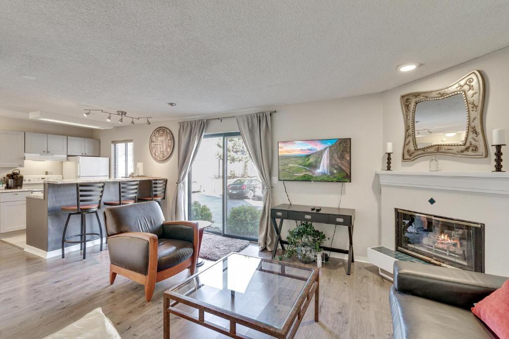 a living room with a couch and a fireplace at Boston Commons - 1143 in Greenwood Village