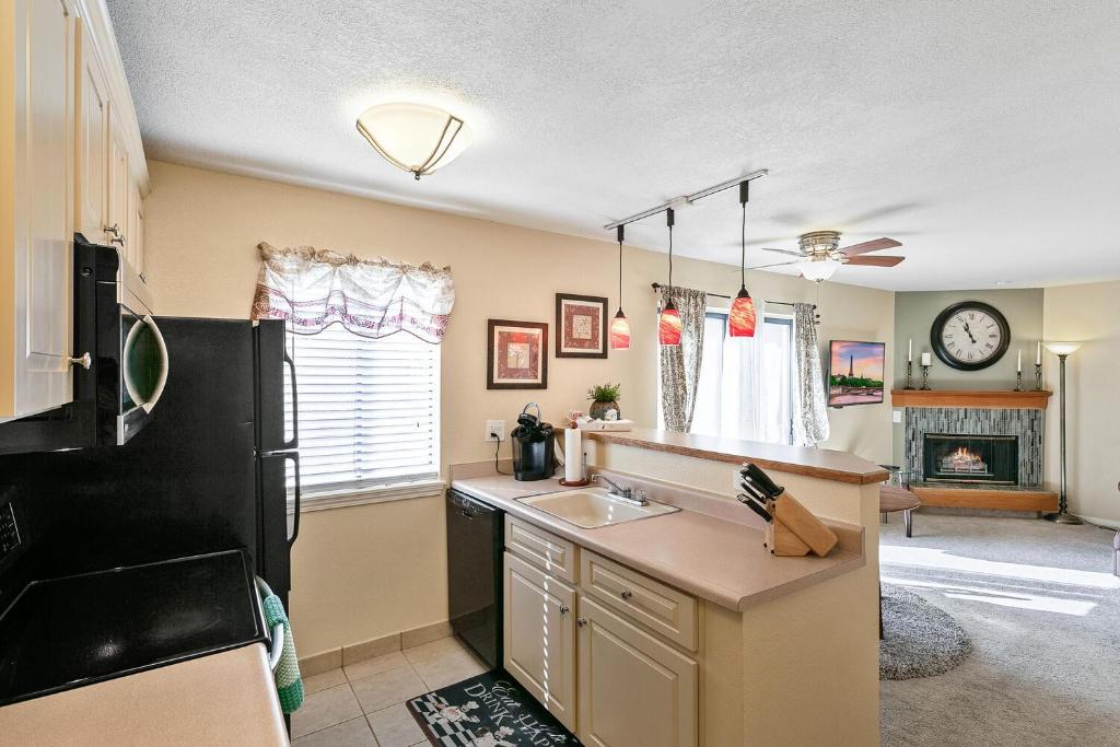 a kitchen with a sink and a counter top at Boston Commons - 1167 in Greenwood Village