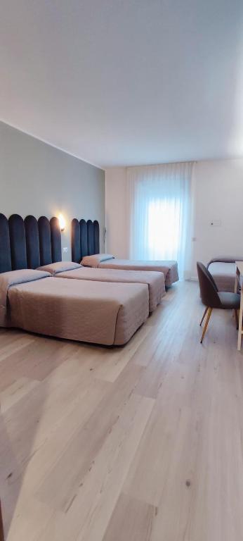 Posteľ alebo postele v izbe v ubytovaní Hotel Everest Arco