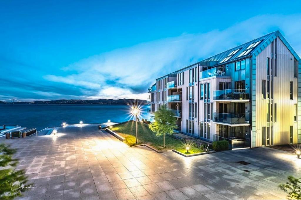 an apartment building with a view of the water at Cityfjord apartment in Bergen centrum in Bergen