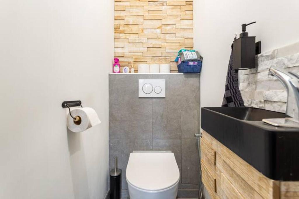 a small bathroom with a toilet and a sink at Maison des voyageurs Cerise - PARIS ORLY in Choisy-le-Roi