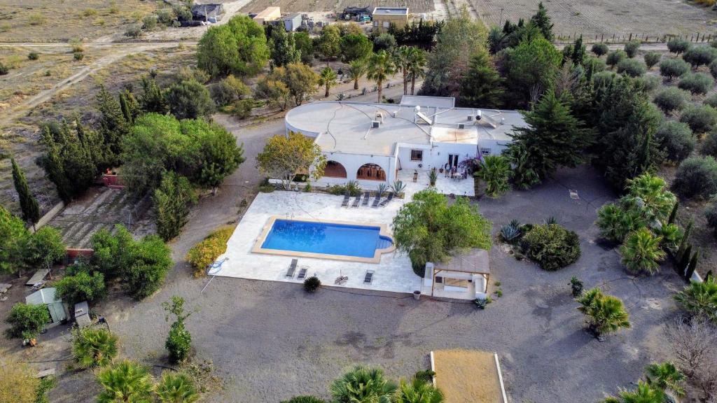 an aerial view of a house with a swimming pool at Cortijo Oro Verde B&B in Tabernas