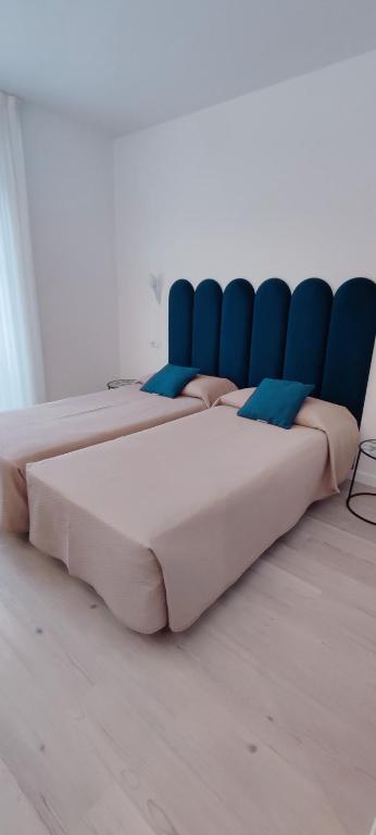 Posteľ alebo postele v izbe v ubytovaní Hotel Everest Arco