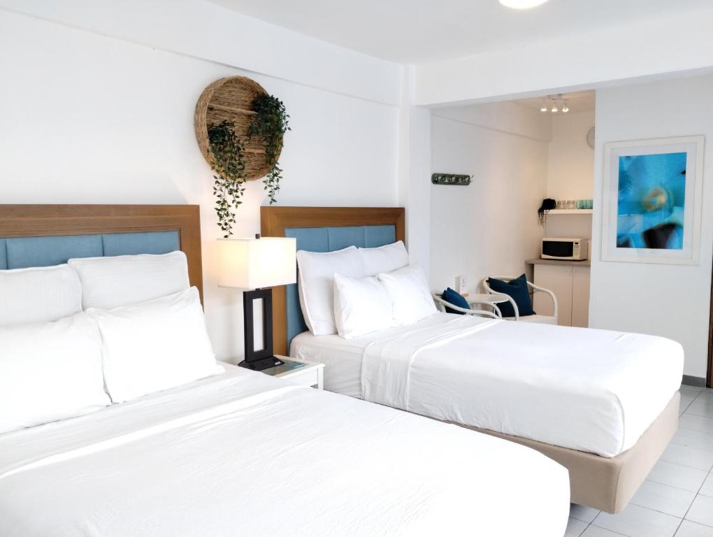 Postel nebo postele na pokoji v ubytování Trinitaria House Hotel
