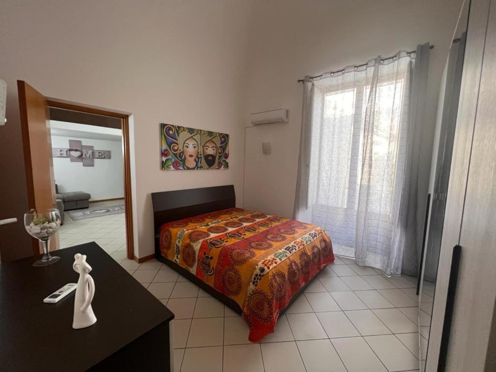 Posteľ alebo postele v izbe v ubytovaní Casa Catania Inn
