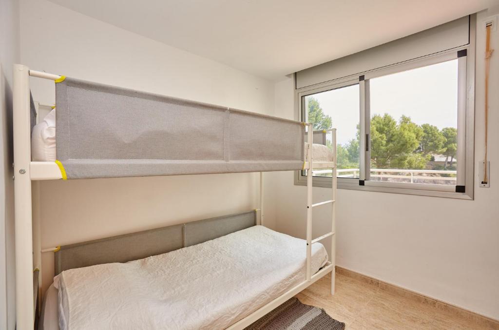 Posteľ alebo postele v izbe v ubytovaní Paraíso en Cala Llobeta