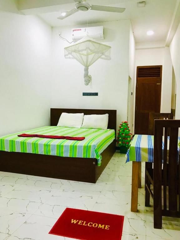 Postel nebo postele na pokoji v ubytování Green jade Inn Mirissa
