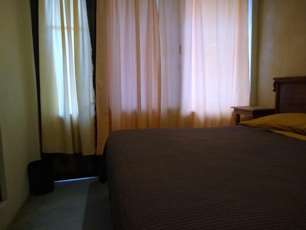 Postel nebo postele na pokoji v ubytování Posada Lindavista