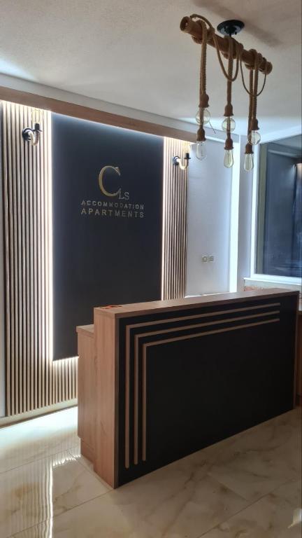 a stage in a room with a sign on the wall at Cavleski apartment in Prilep