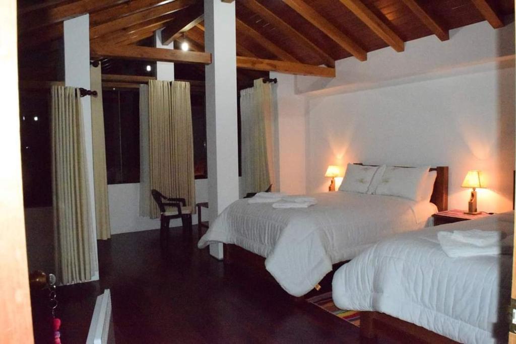 מיטה או מיטות בחדר ב-Casa Andina - Isla del Sol-Bolivia