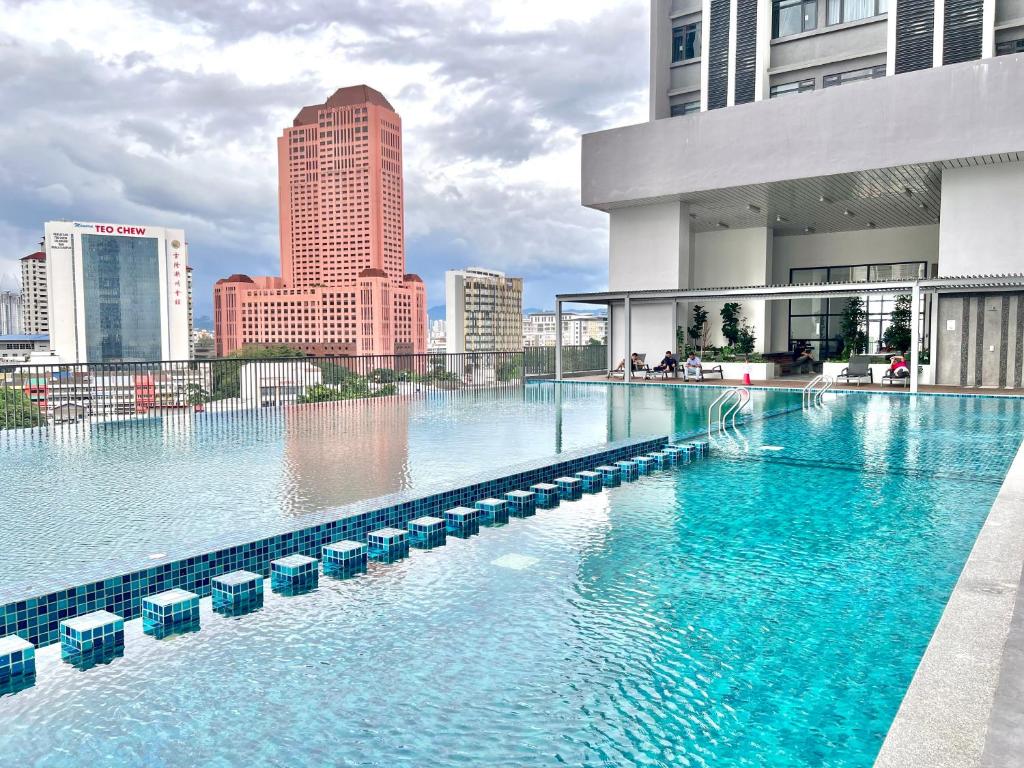 a large swimming pool on top of a building at KL Chambers Suites in Kuala Lumpur