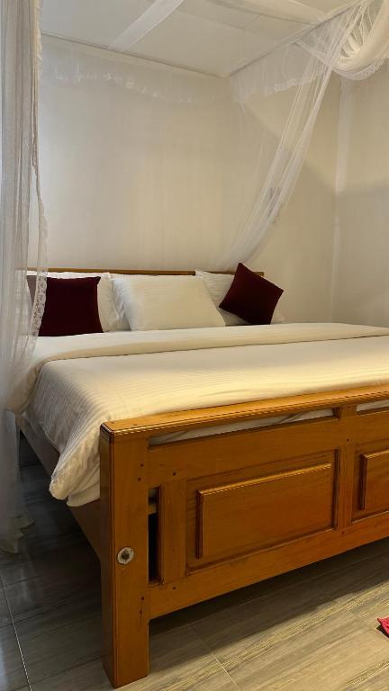 Postel nebo postele na pokoji v ubytování Cinnamon Homestay ella