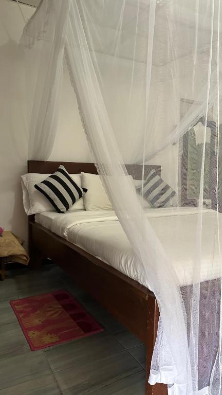 Postel nebo postele na pokoji v ubytování Cinnamon Homestay ella