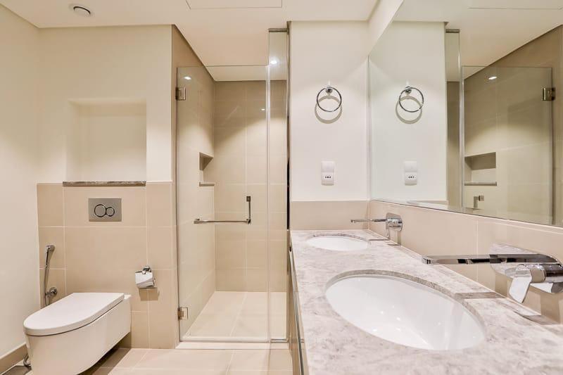 a bathroom with a sink and a toilet at BJ's luxury Burj and Creek View 2 BR Apartment in Dubai