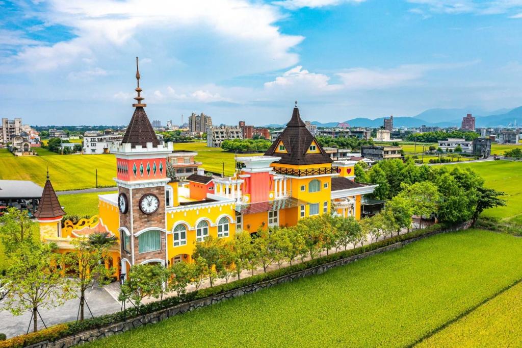 a building with a clock tower in a city at Jane Castle in Wujie