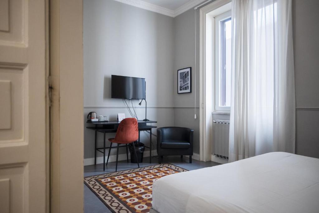 A bed or beds in a room at casa mo room and suite