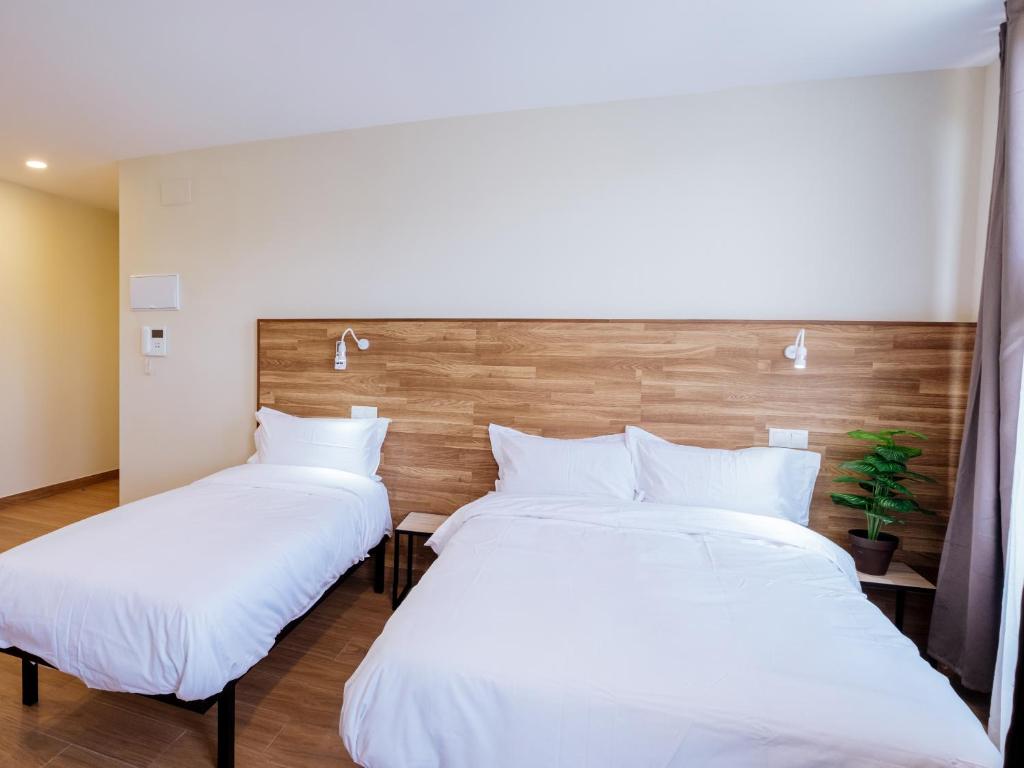 Postel nebo postele na pokoji v ubytování Apartahotel Golden Alcalá